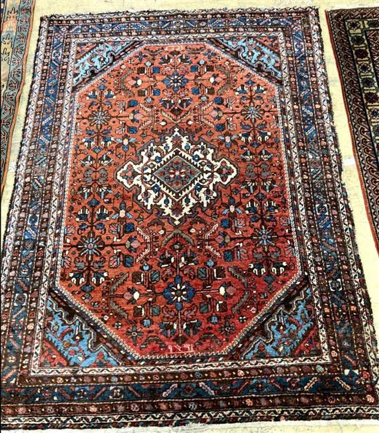 A Kurdish red ground rug, 205 x 154cm